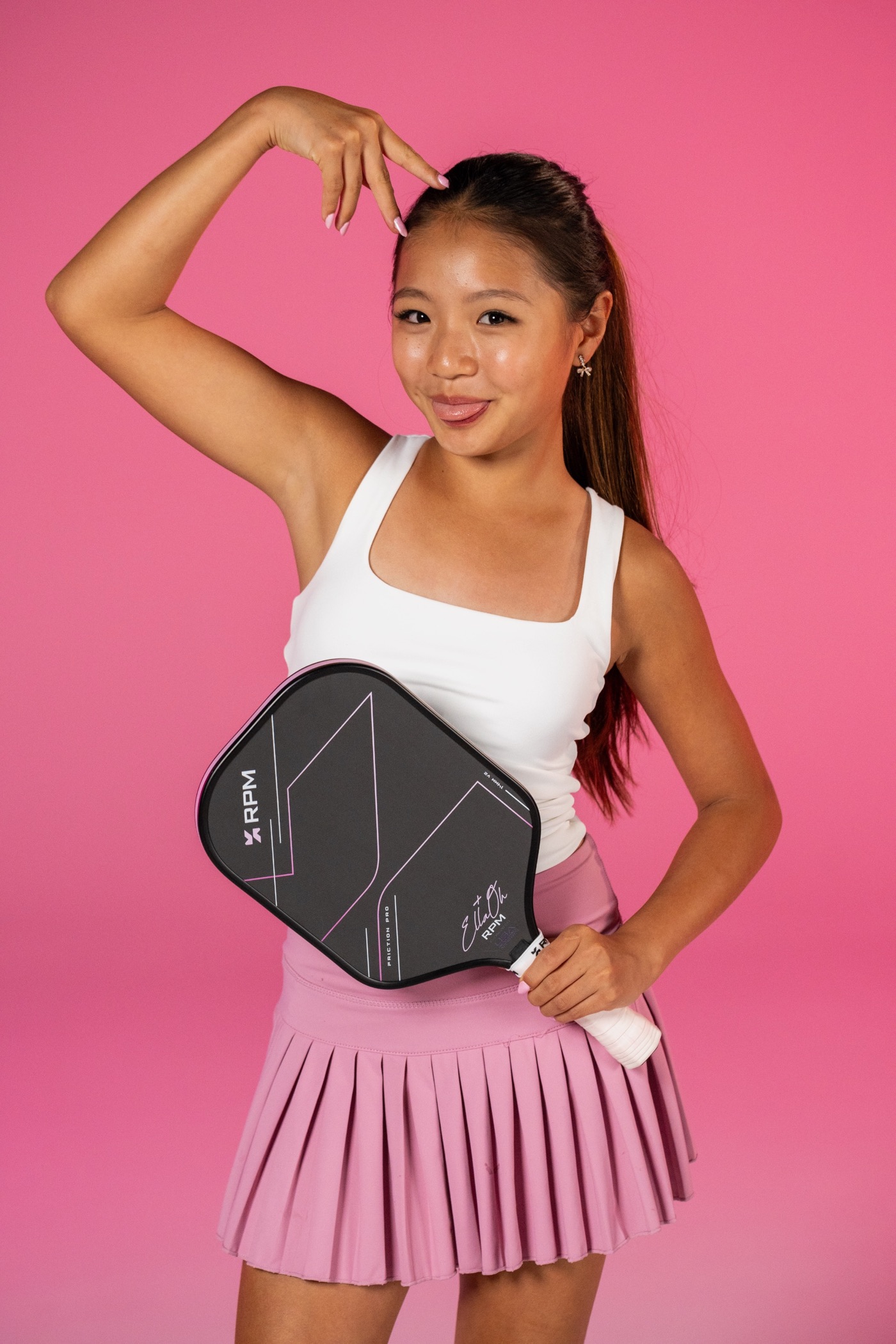 Close-up portrait of Ella Oh with her RPM signature pickleball paddle